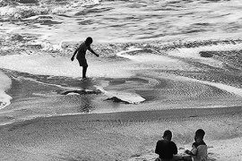 three boys on a beach 